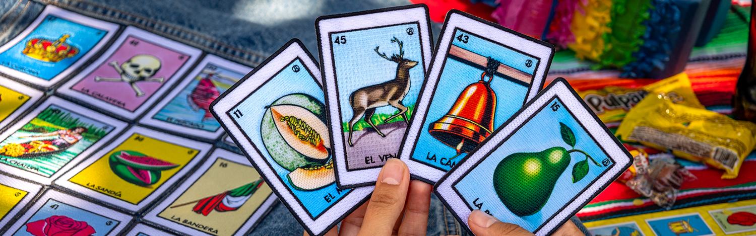 playing mexican loteria with a handful of embroidred loteria inspired patches