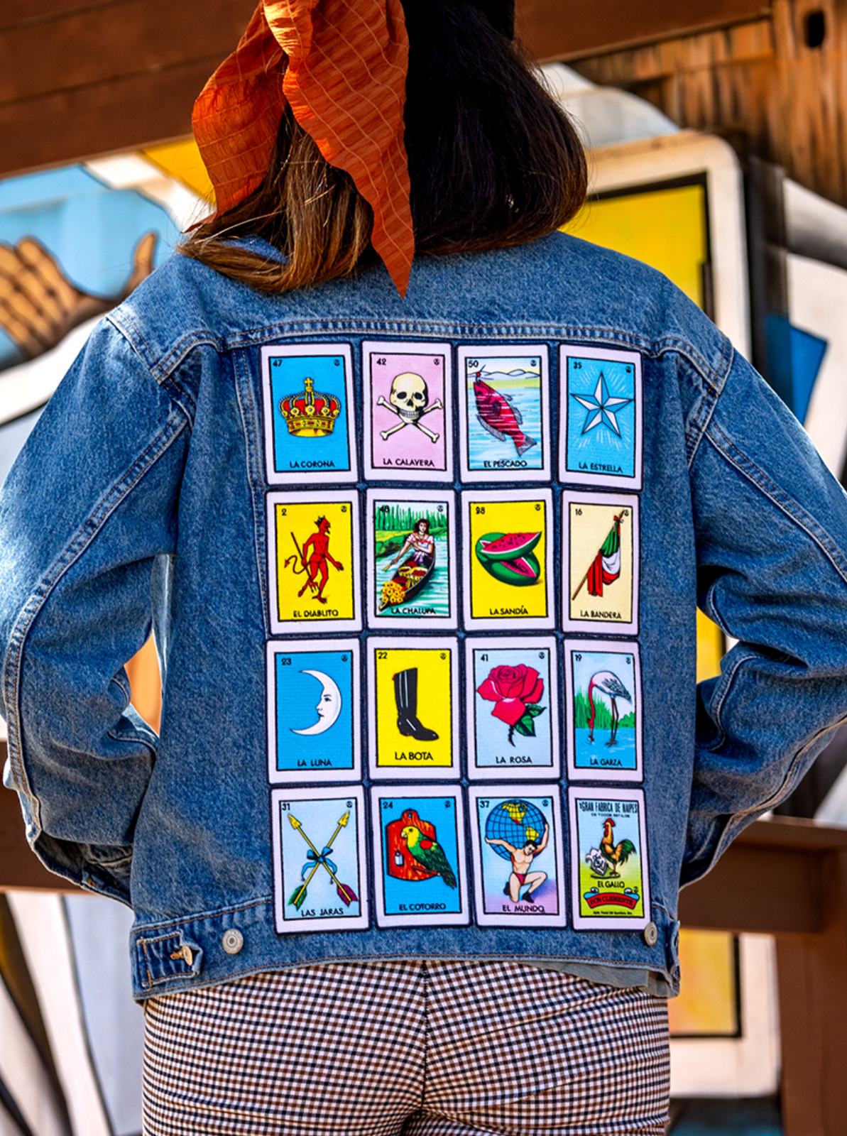 mexican loteria patches on top of a demin jacket