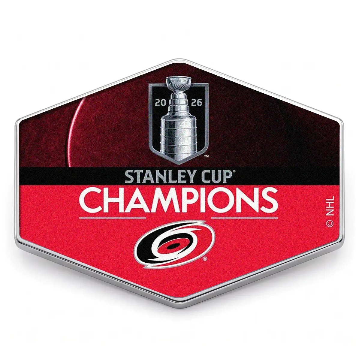 Hexagonal badge with Stanley Cup Champions text and Carolina Hurricanes logo on a white background