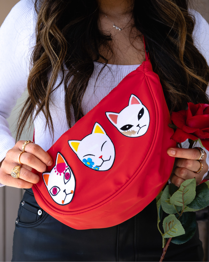 anime patches on a red fanni pack