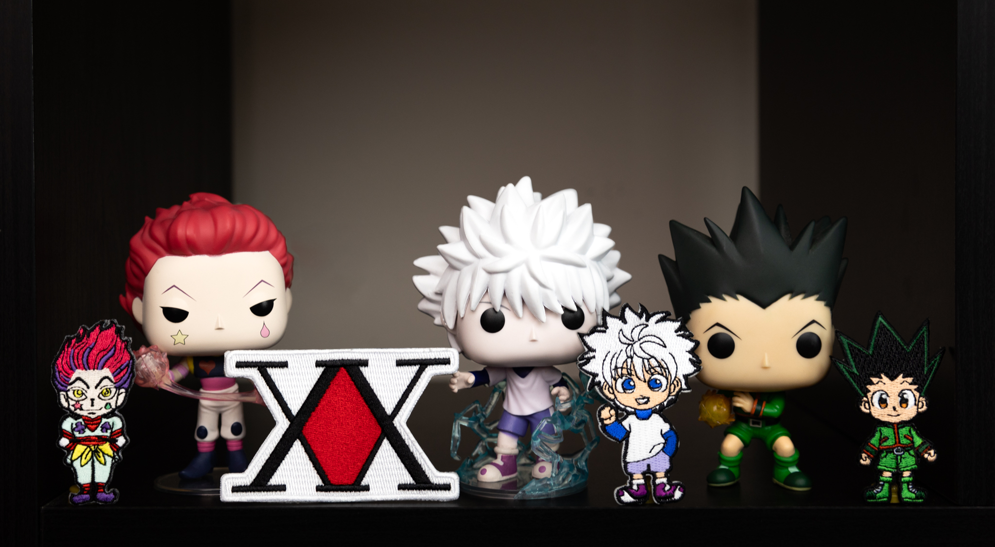 Collection of Funko Pop! figurines in front of a dark background