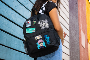 bag with anime patches assorted over panels