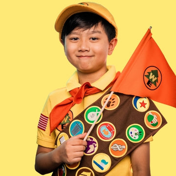 Cute Boy with a Variety of Wilderness Explorer Patches
