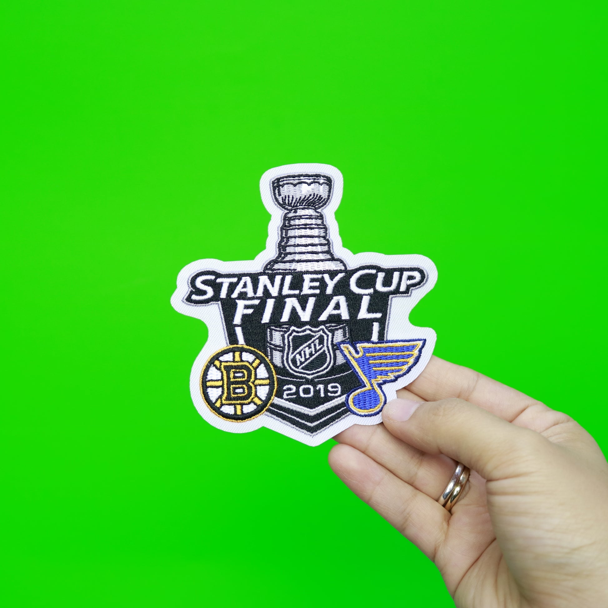 https://patchcollection.com/cdn/shop/products/2019STANLEYCUPDUELINGPATCHWITHHAND.jpg?v=1650897889&width=1946