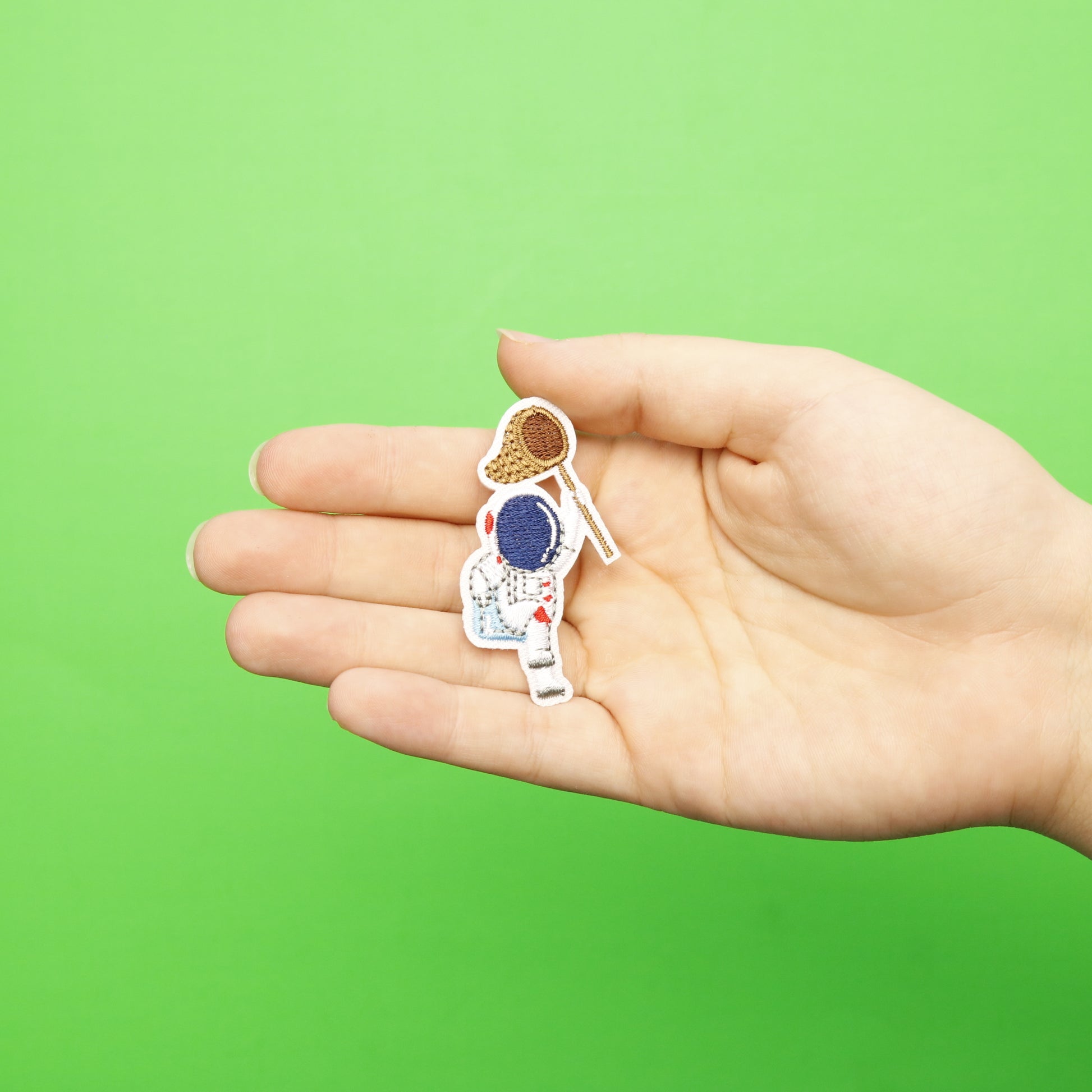 Small Astronaut Holding A Net Embroidered Iron On Patch 